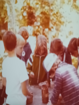 Picture from the late 60s showing a teaching moment with elementary students